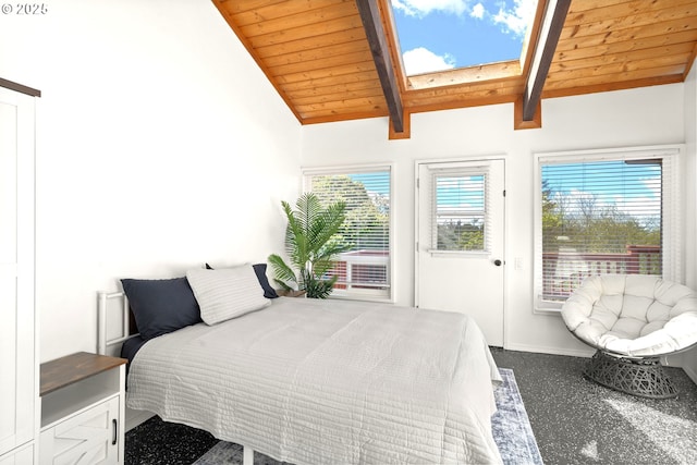 32890 Hillside Acres Rd, Gold Beach, OR 97444 - carpeted bedroom with baseboards, wooden ceiling, access to outside, and vaulted ceiling with skylight