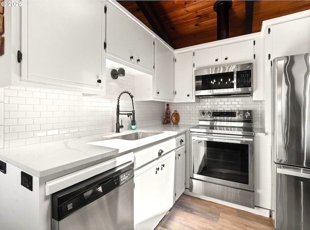 32890 Hillside Acres Rd, Gold Beach, OR 97444 - kitchen featuring a sink, wooden ceiling, appliances with stainless steel finishes, and tasteful backsplash