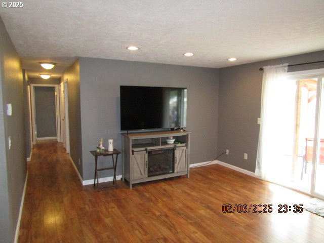 unfurnished living room featuring hardwood / wood-style flooring