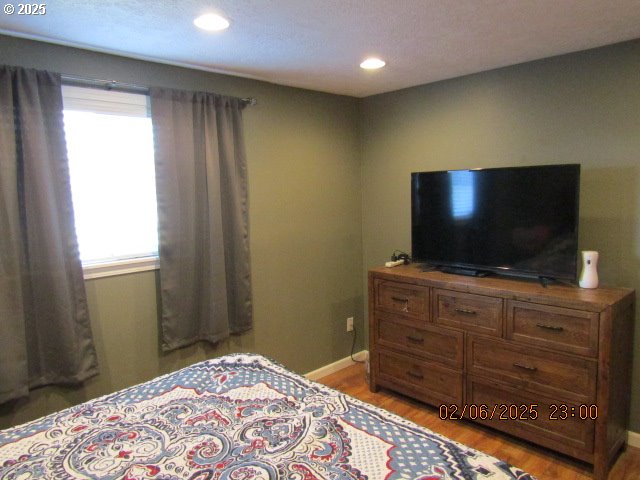 bedroom with light hardwood / wood-style floors