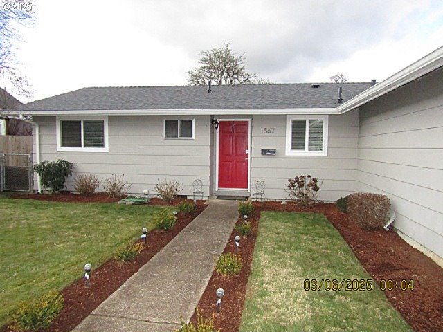 property entrance with a yard