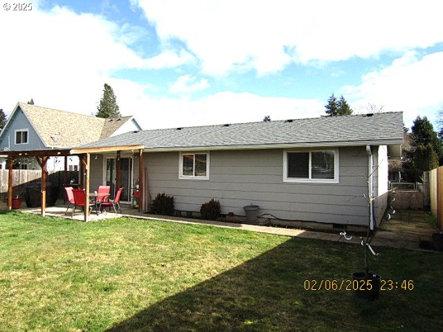 single story home with a garage and a front yard