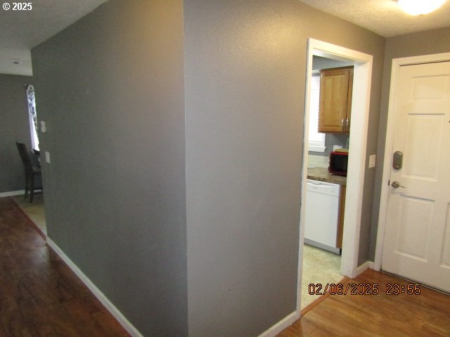 hallway featuring wood-type flooring