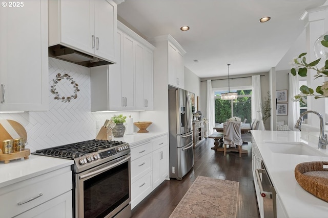 1720 W Meadows Dr NW, Salem, OR 97304 - kitchen featuring stainless steel appliances, a sink, light countertops, white cabinetry, and recessed lighting