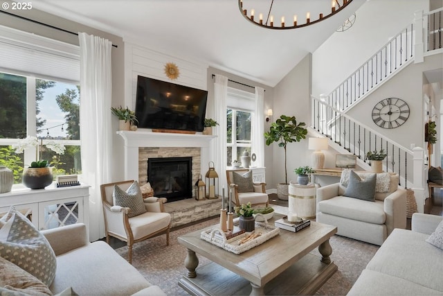1720 W Meadows Dr NW, Salem, OR 97304 - living area featuring stairway, a stone fireplace, and a chandelier