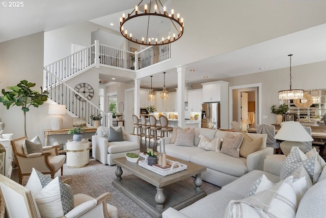 1720 W Meadows Dr NW, Salem, OR 97304 - living room featuring a chandelier, a towering ceiling, stairway, ornate columns, and recessed lighting