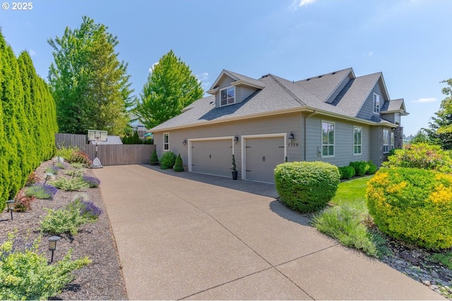 1720 W Meadows Dr NW, Salem, OR 97304 - view of home's exterior with driveway, a garage, and roof with shingles