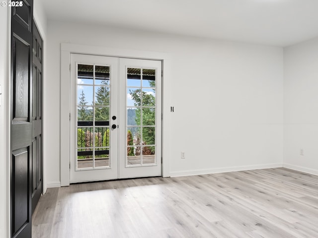 entryway featuring french doors and light wood-type flooring