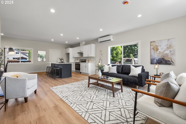 4221 Hudson Ave, Salem, OR 97301 - living area featuring a wall mounted air conditioner, light wood finished floors, and recessed lighting