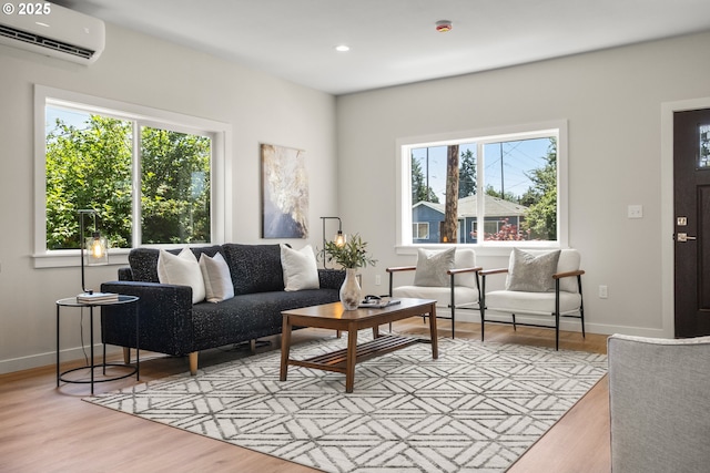 4221 Hudson Ave, Salem, OR 97301 - living room featuring an AC wall unit, plenty of natural light, light wood finished floors, and recessed lighting