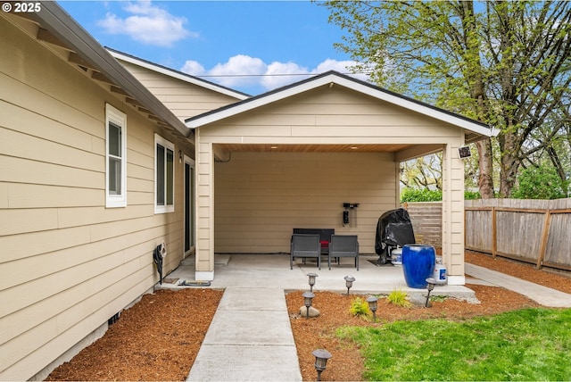 view of patio / terrace featuring fence