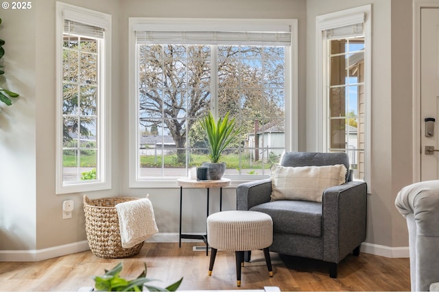 sitting room featuring wood finished floors and baseboards