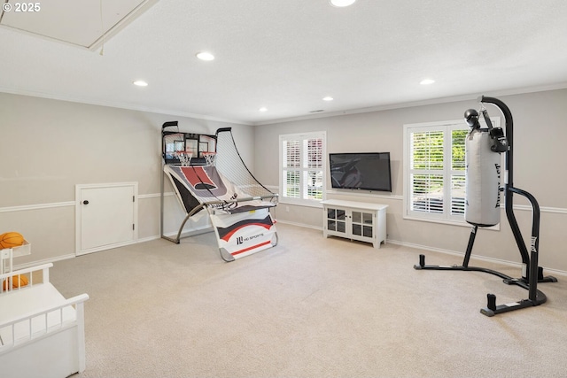 exercise area featuring recessed lighting, carpet flooring, ornamental molding, baseboards, and attic access