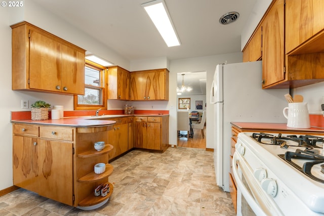 kitchen featuring open shelves, brown cabinets, visible vents, and white range with gas stovetop