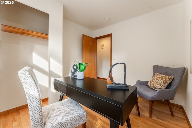 office featuring wood finished floors and baseboards