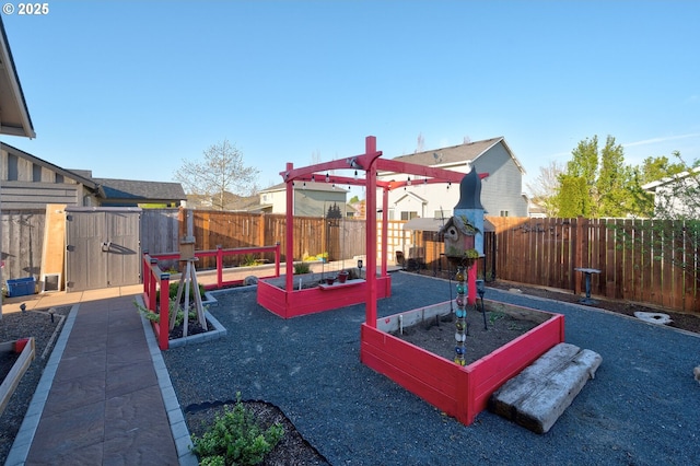 1531 Washington St, Independence, OR 97351 - fenced backyard featuring a vegetable garden and a storage unit