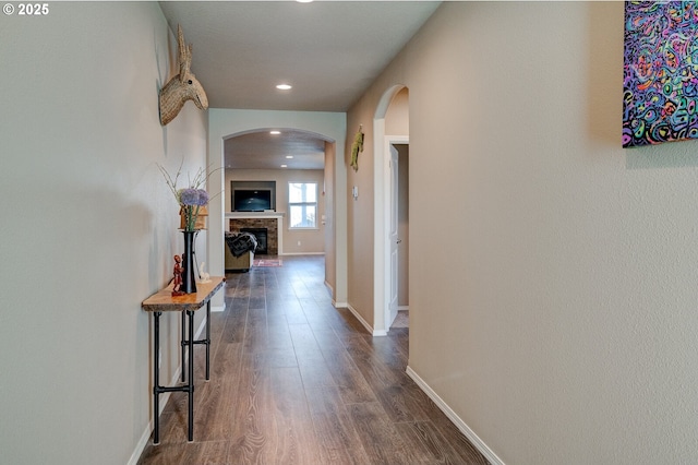 1531 Washington St, Independence, OR 97351 - hallway with arched walkways, dark wood-style floors, baseboards, and recessed lighting