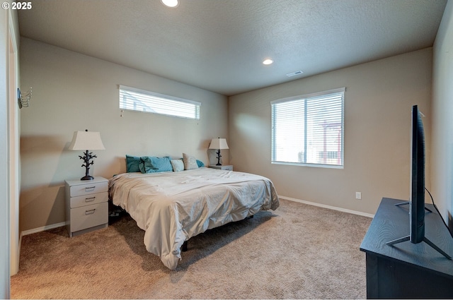1531 Washington St, Independence, OR 97351 - bedroom with multiple windows, light colored carpet, baseboards, recessed lighting, and a textured ceiling