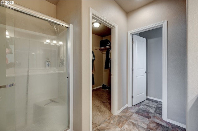 1531 Washington St, Independence, OR 97351 - bathroom featuring a shower stall, a spacious closet, and baseboards