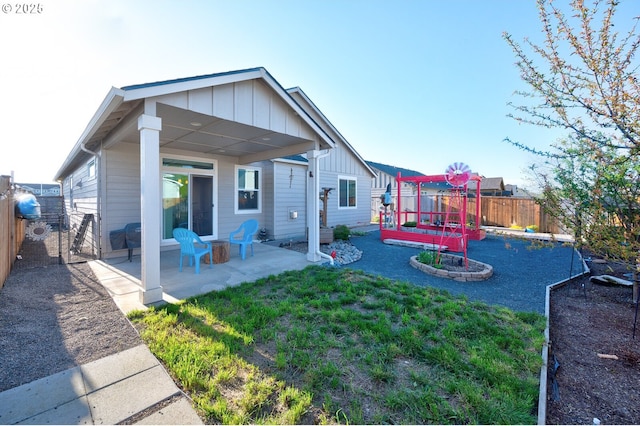 1531 Washington St, Independence, OR 97351 - back of house featuring board and batten siding and a patio