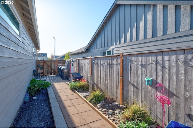 1531 Washington St, Independence, OR 97351 - view of side of home with board and batten siding and a gate