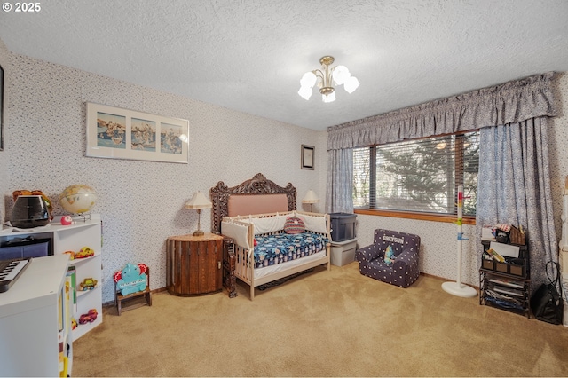 carpeted bedroom with wallpapered walls, a textured ceiling, and an inviting chandelier