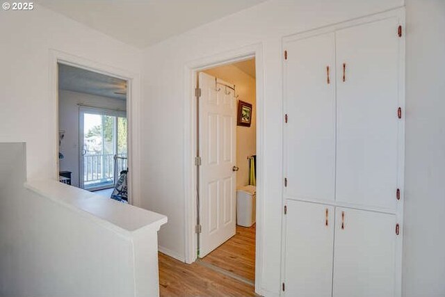 corridor featuring light wood-style flooring