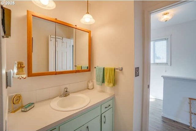 bathroom featuring vanity and wood finished floors