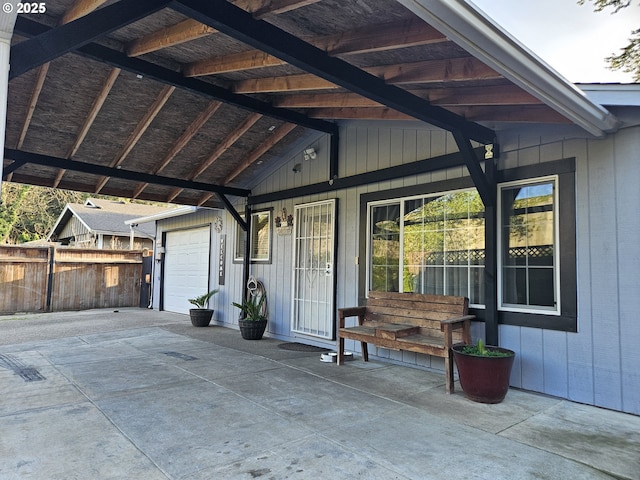 garage with fence