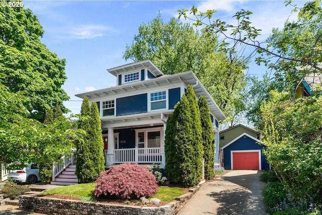 traditional style home featuring a porch, an outdoor structure, a garage, and concrete driveway