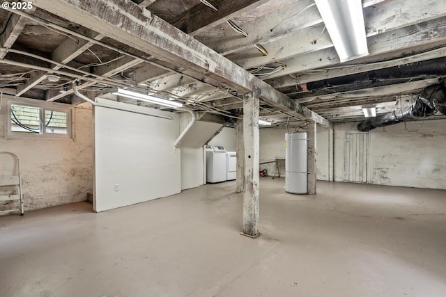 basement with washer and clothes dryer and gas water heater