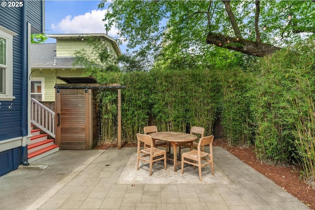 view of patio featuring outdoor dining area