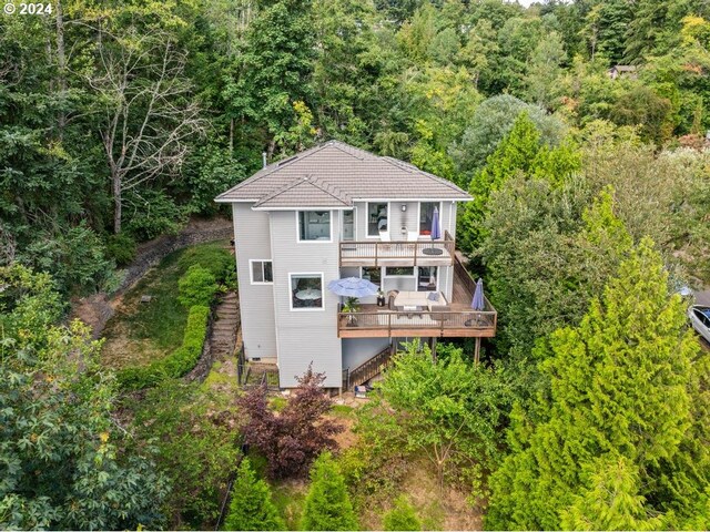 8427 NW Timber Ridge Ct, Portland, OR 97229 - back of house with a forest view, a deck, and stairway