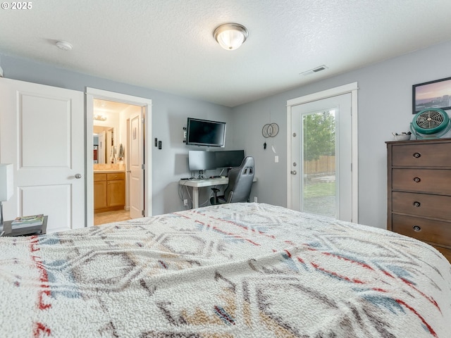 3190 Lily Ln, Mcminnville, OR 97128 - bedroom featuring access to exterior, a textured ceiling, and ensuite bath