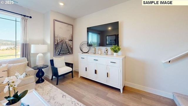 sitting room with light wood-type flooring