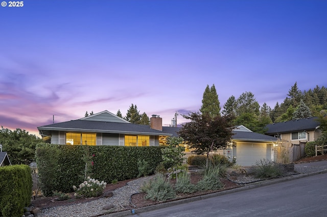 1565 Meadows Dr, Lake Oswego, OR 97034 - view of front facade with an attached garage and a chimney