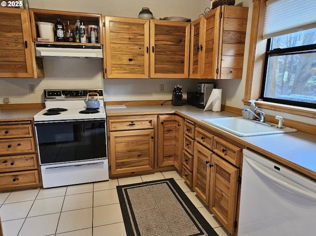 804 Riverside St, Maupin, OR 97037 - kitchen featuring white appliances, under cabinet range hood, a sink, light countertops, and light tile patterned floors