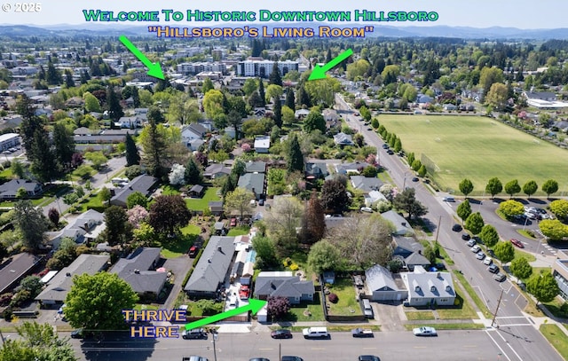 birds eye view of property with a residential view
