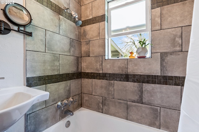 full bath featuring  shower combination and a sink
