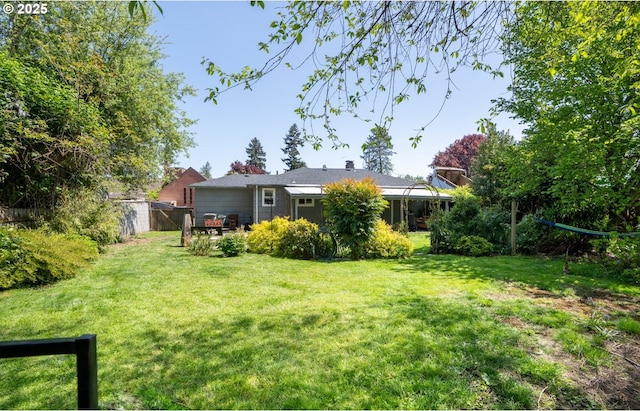 view of yard featuring fence