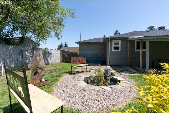 view of yard with fence and a patio area