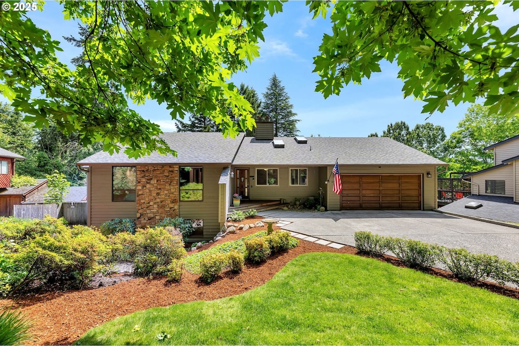 4315 NE 26th Ct, Vancouver, WA 98663 - ranch-style home with concrete driveway, an attached garage, and roof with shingles