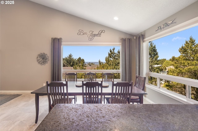 8985 Chinook Ln, Manzanita, OR 97130 - dining area featuring lofted ceiling and recessed lighting