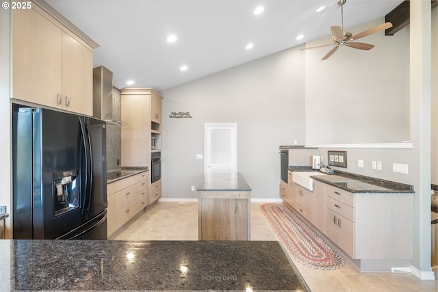 8985 Chinook Ln, Manzanita, OR 97130 - kitchen with black appliances, wall chimney exhaust hood, light brown cabinets, a ceiling fan, and a center island