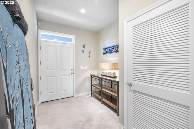 8985 Chinook Ln, Manzanita, OR 97130 - entrance foyer with a textured ceiling and recessed lighting