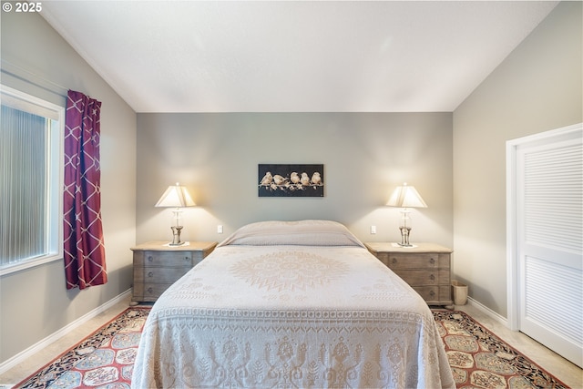 8985 Chinook Ln, Manzanita, OR 97130 - bedroom featuring lofted ceiling and multiple windows