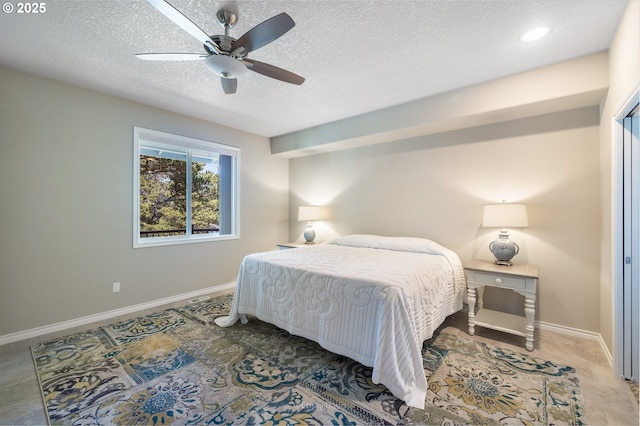 8985 Chinook Ln, Manzanita, OR 97130 - bedroom with a textured ceiling and a ceiling fan