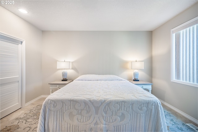 8985 Chinook Ln, Manzanita, OR 97130 - bedroom featuring multiple windows and recessed lighting