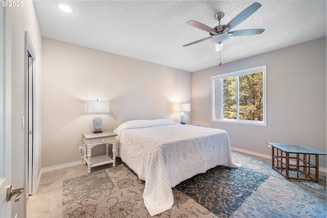 8985 Chinook Ln, Manzanita, OR 97130 - bedroom featuring a textured ceiling and a ceiling fan