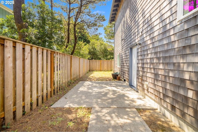 8985 Chinook Ln, Manzanita, OR 97130 - fenced backyard featuring a patio area